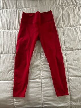 Red Fabletics PowerHold 7/8 ankle leggings with inside pocket (M)